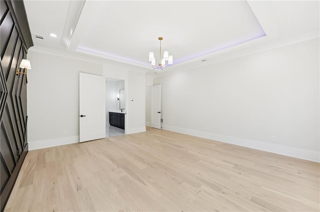 3207 Bold Springs Road Dacula, GA 30019 - Photo 21 of 67 a view of an empty room with a chandelier