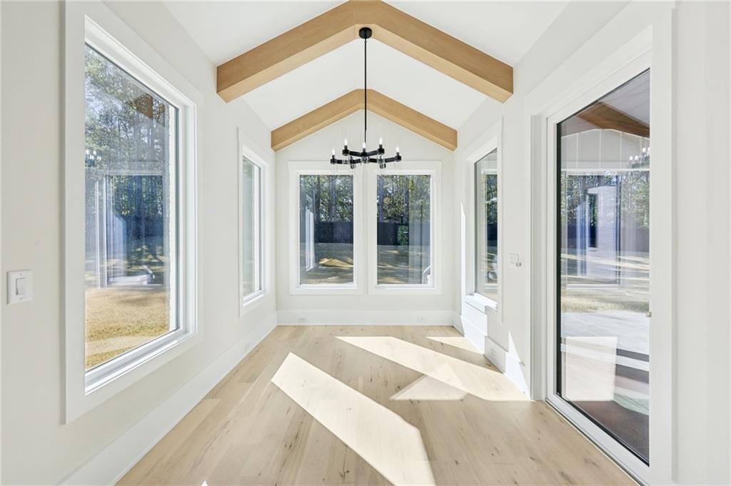 3207 Bold Springs Road Dacula, GA 30019 - Photo 22 of 67 a very nice looking room with a large window and a chandelier