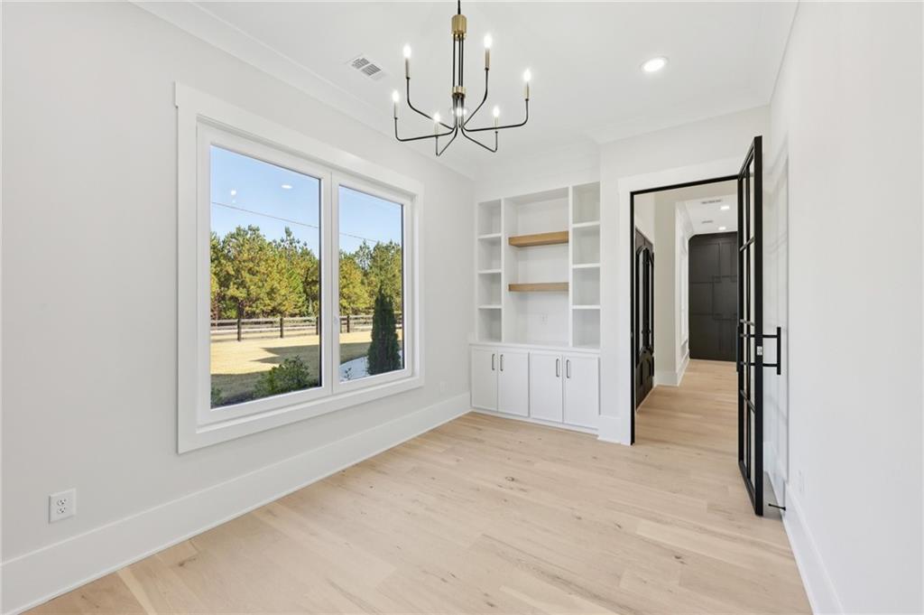 3207 Bold Springs Road Dacula, GA 30019 - Photo 23 of 67 a view of empty room with wooden floor and fan