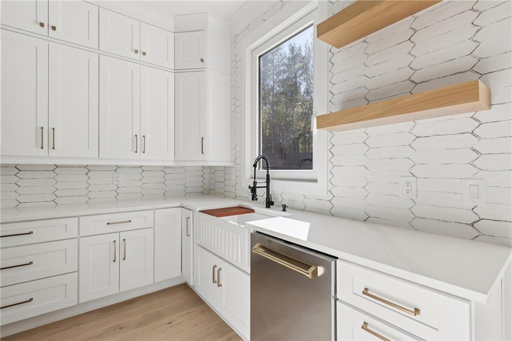 3207 Bold Springs Road Dacula, GA 30019 - Photo 31 of 67 a kitchen with a sink and cabinets