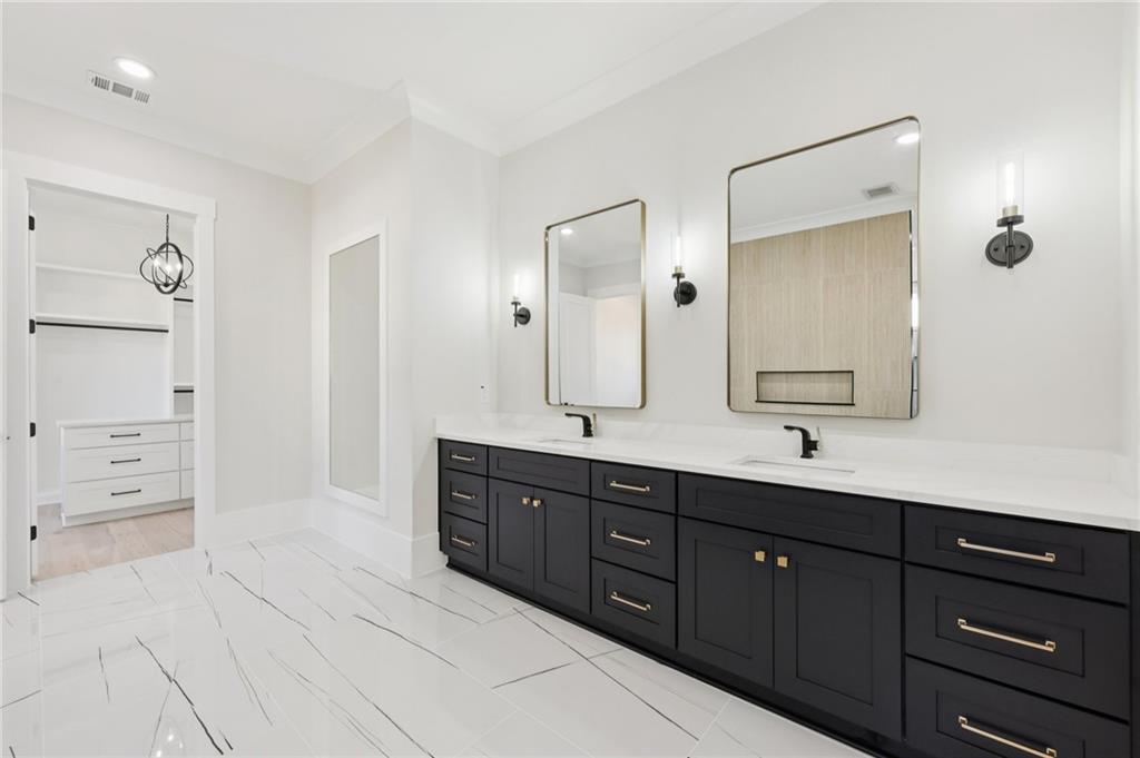 3207 Bold Springs Road Dacula, GA 30019 - Photo 36 of 67 a spacious bathroom with a granite countertop sink mirror and