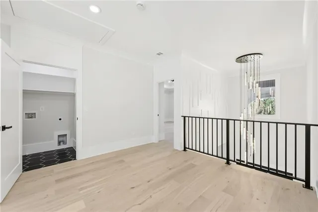 a view of an empty room with a fireplace and a window