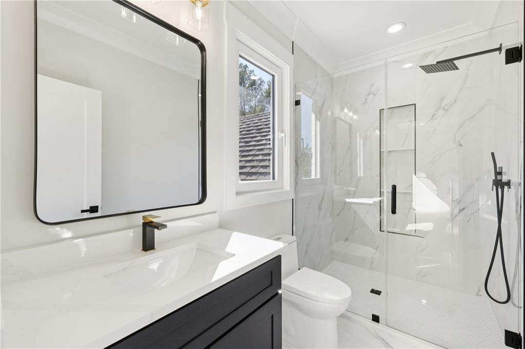 3207 Bold Springs Road Dacula, GA 30019 - Photo 52 of 67 a bathroom with a sink a toilet and shower