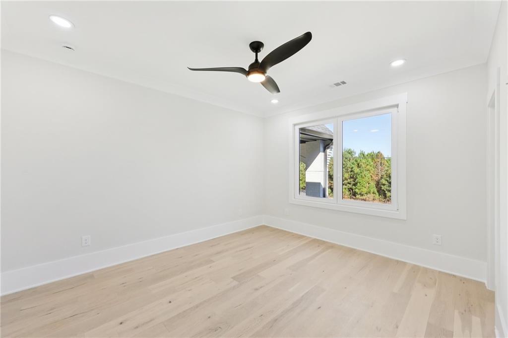3207 Bold Springs Road Dacula, GA 30019 - Photo 55 of 67 an empty room with wooden floor and windows