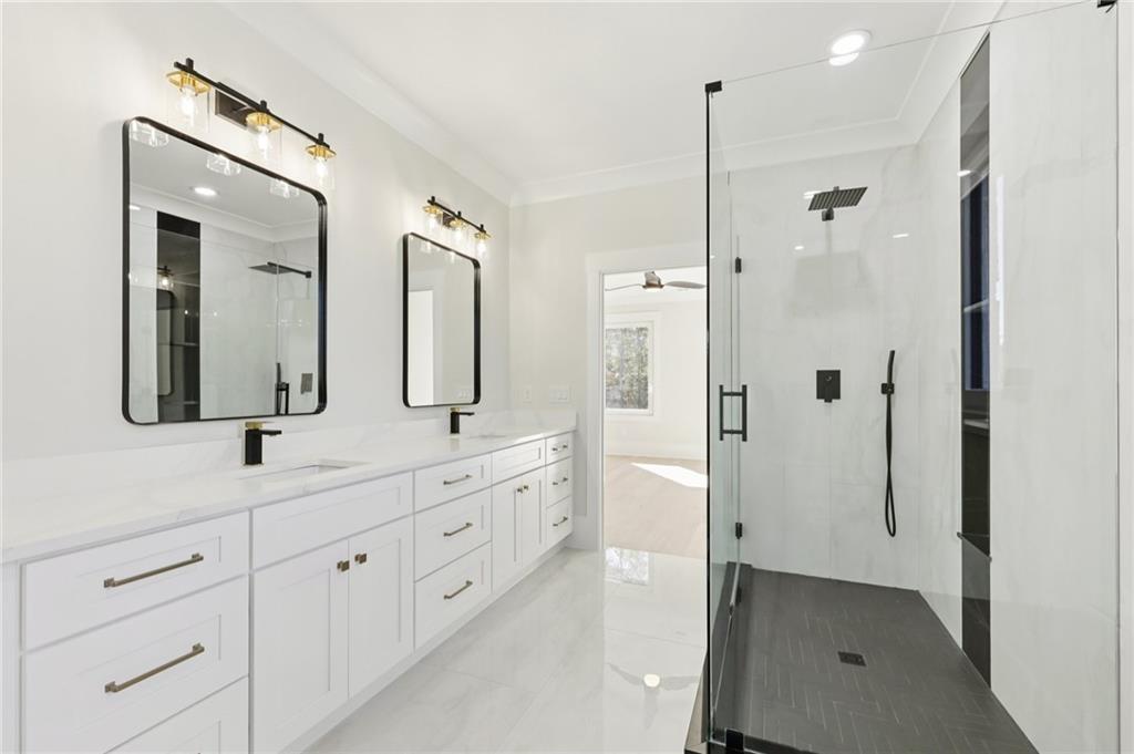 3207 Bold Springs Road Dacula, GA 30019 - Photo 60 of 67 a bathroom with a double vanity sink mirror and double