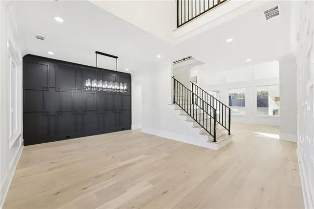 a view of entryway and hall with wooden floor