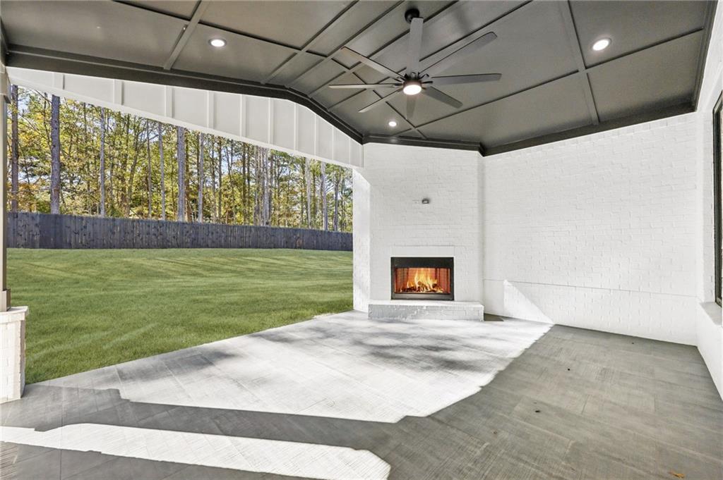 3207 Bold Springs Road Dacula, GA 30019 - Photo 63 of 67 a view of an empty room with a fireplace and a window