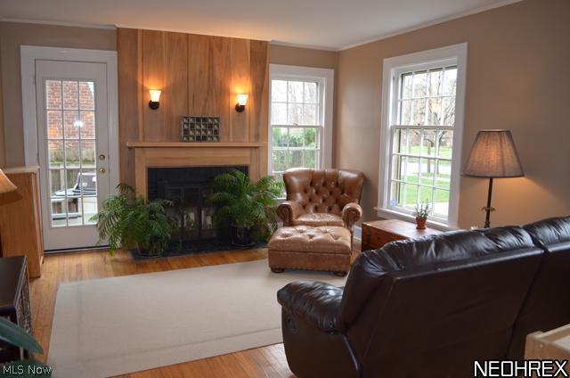 3304 Chalfant Road Cleveland, OH 44120 - Photo 3 of 17 Wonderful light filled living room with wood floors, fireplace, natural light and door leading to deck and fenced yard.