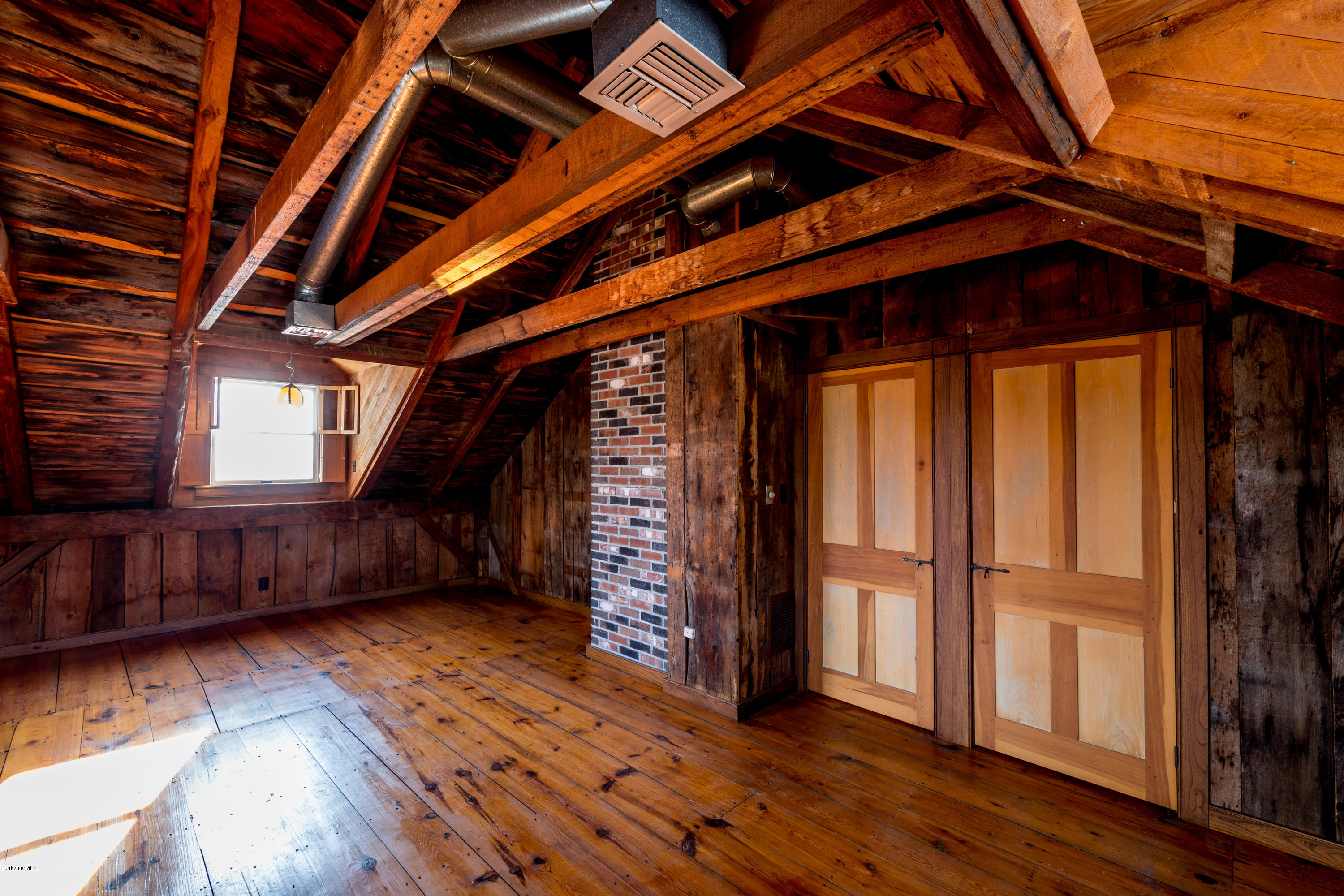 54 Patten Road Shelburne, MA 01370 - Photo 18 of 30 a view of an empty room with wooden floor and a window