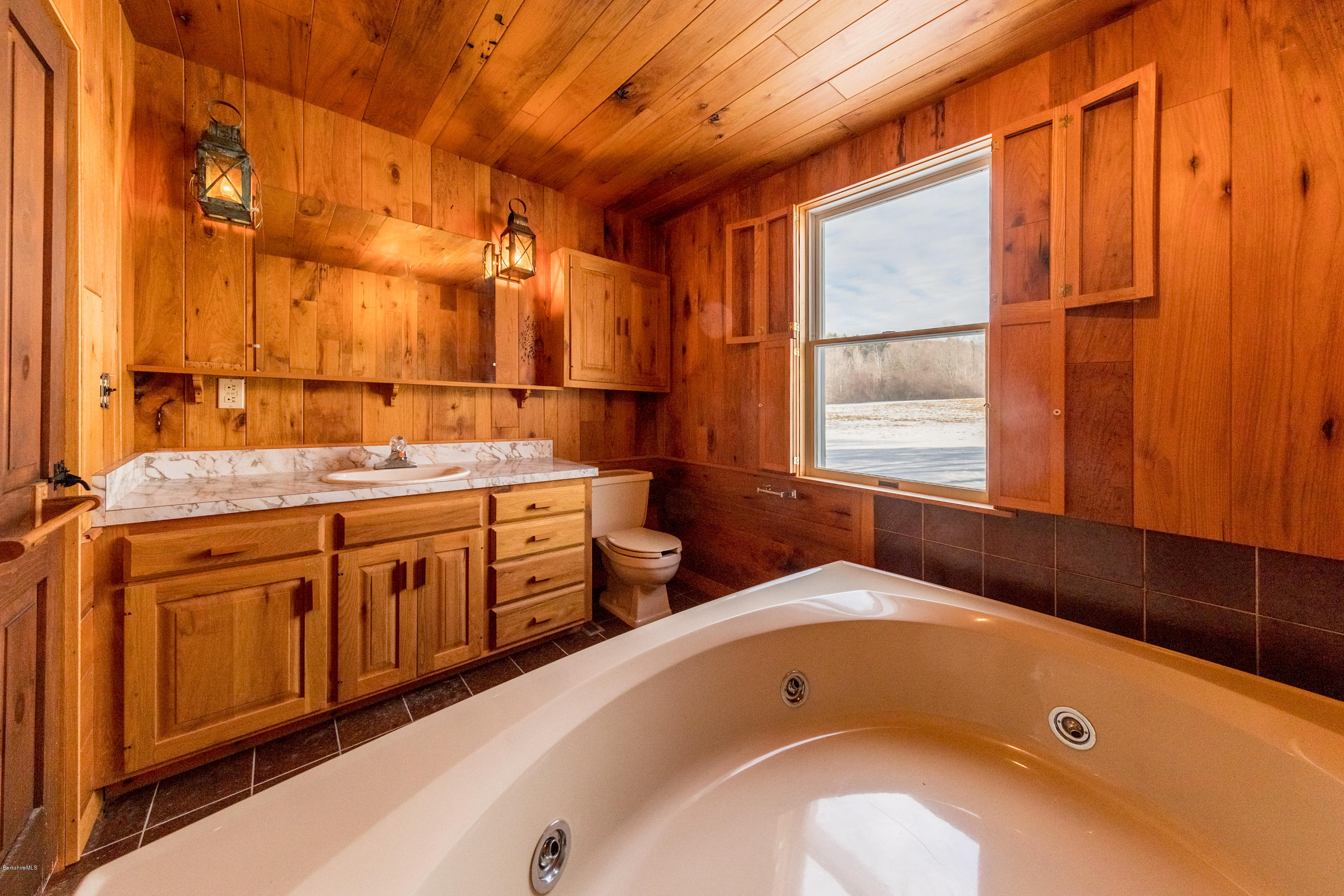 54 Patten Road Shelburne, MA 01370 - Photo 23 of 30 a bathroom with a tub sink and mirror