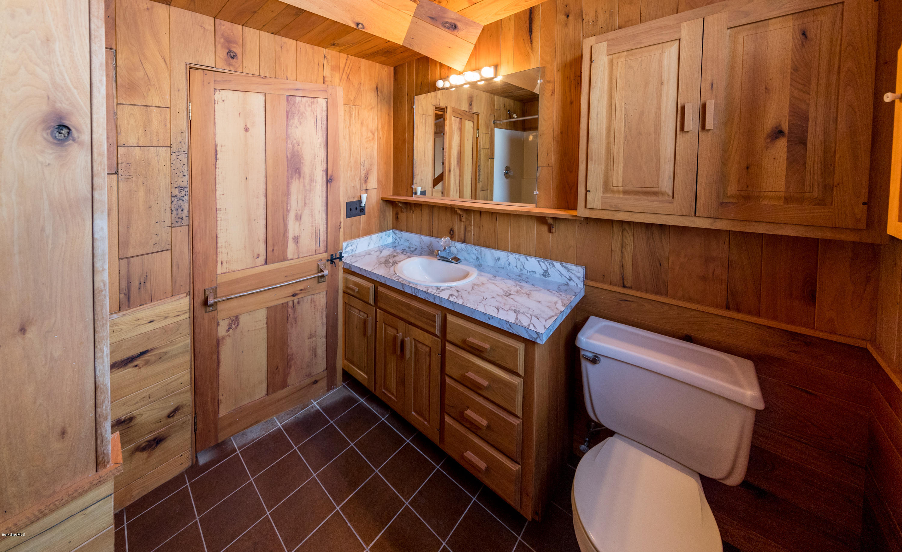 54 Patten Road Shelburne, MA 01370 - Photo 24 of 30 a bathroom with a toilet a sink and mirror