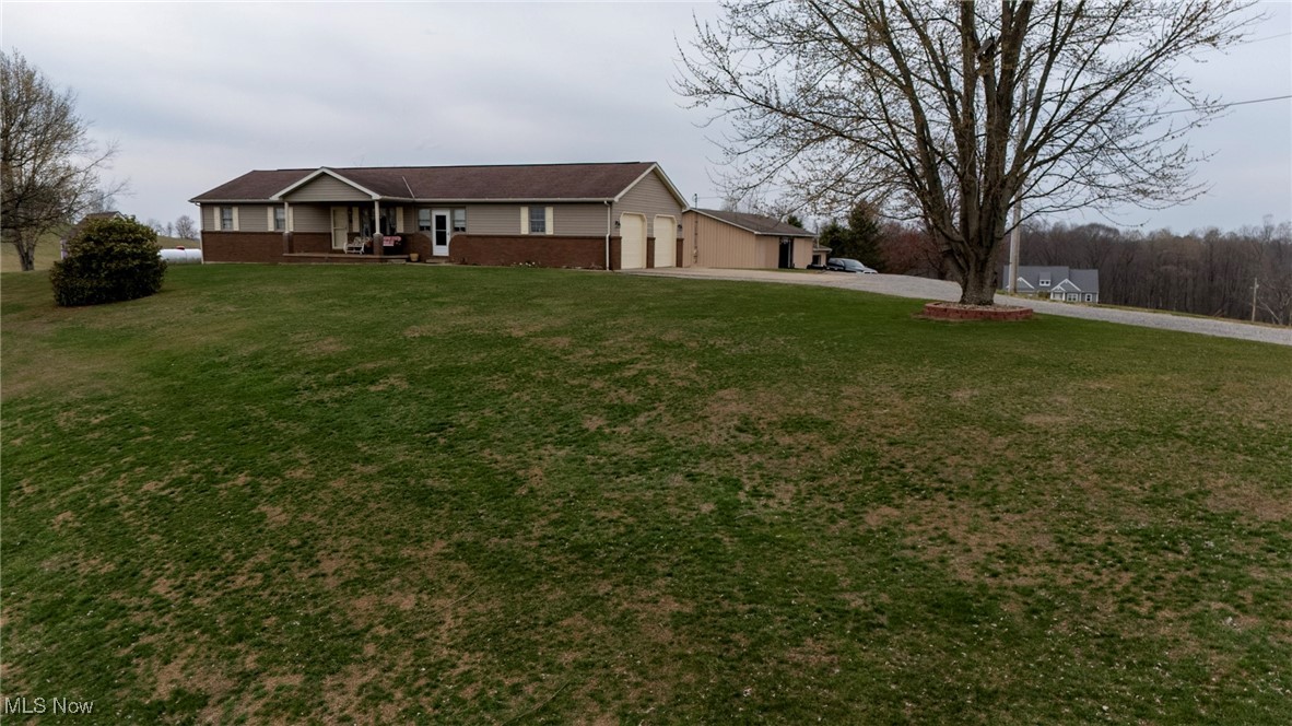 65525 Larrick Ridge Road Cambridge, OH 43725 - Photo 36 of 40 View of the front. As beautiful as the house, that view across the land is breath taking