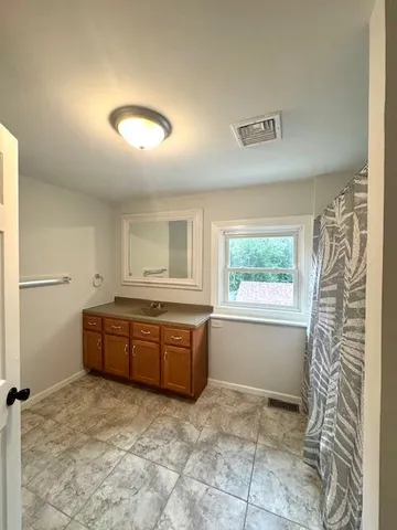 a room with window and cabinets