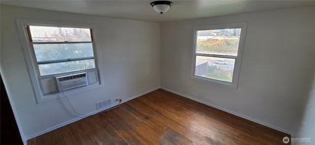an empty room with windows