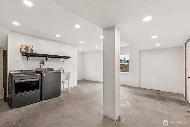 a view of a kitchen with a stove fridge and wooden floor