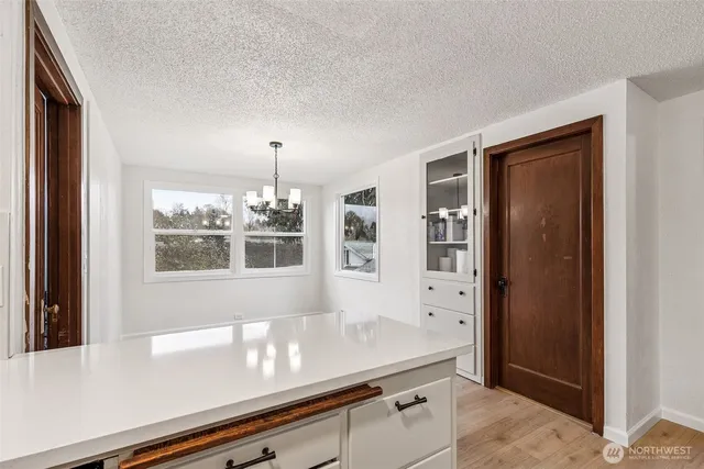a view of open kitchen cabinets window and refrigerator