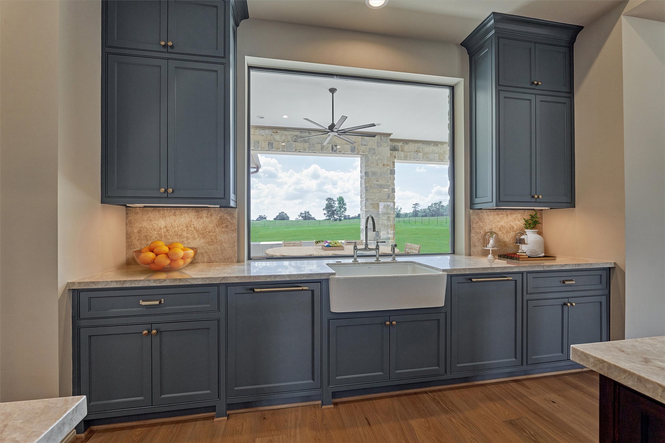 2306 Iris Cove Hockley, TX 77447 - Photo 17 of 50 Farm sink, under counter lighting with views to back yard. Photo is virtually staged/enhanced.