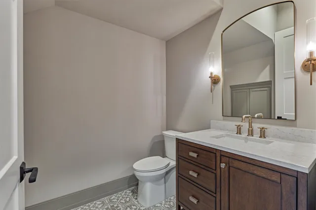 a living room with furniture large window and a chandelier