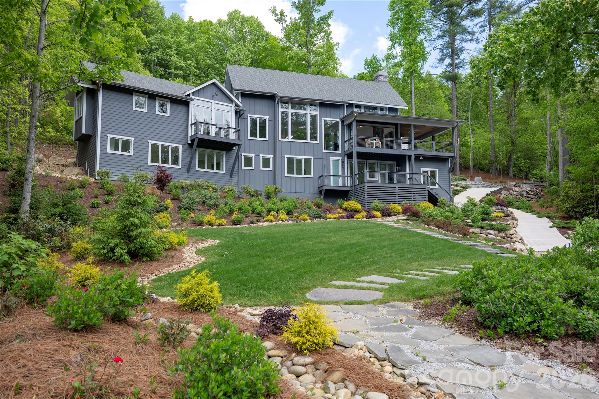 2235 Cold Mountain Road Lake Toxaway, NC 28747 - Photo 42 of 47 a front view of a house with garden