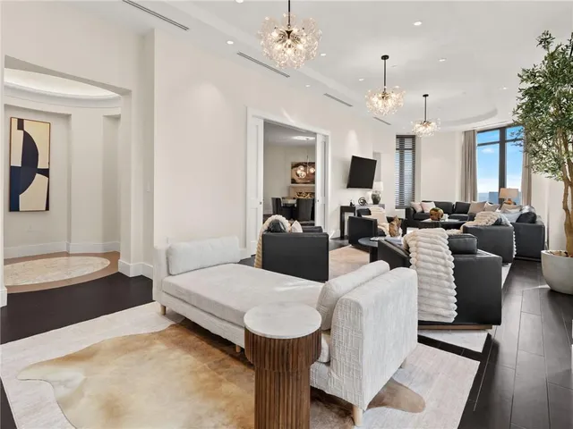 a view of kitchen with sink table and chairs