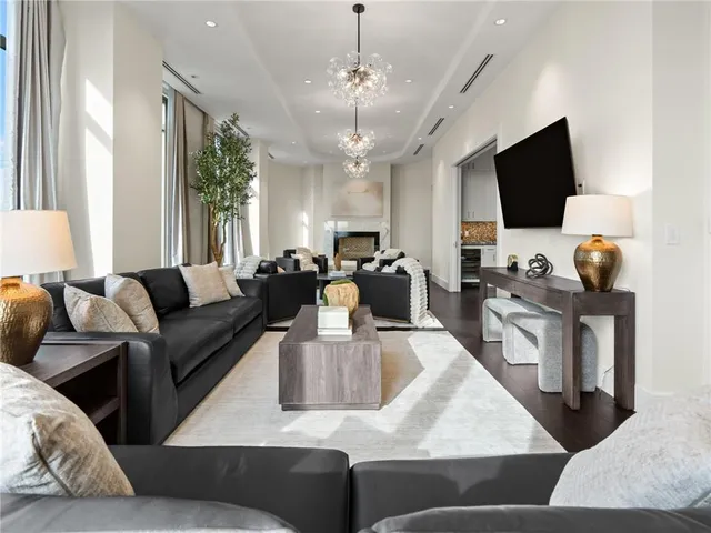 a kitchen with a table chairs and a refrigerator