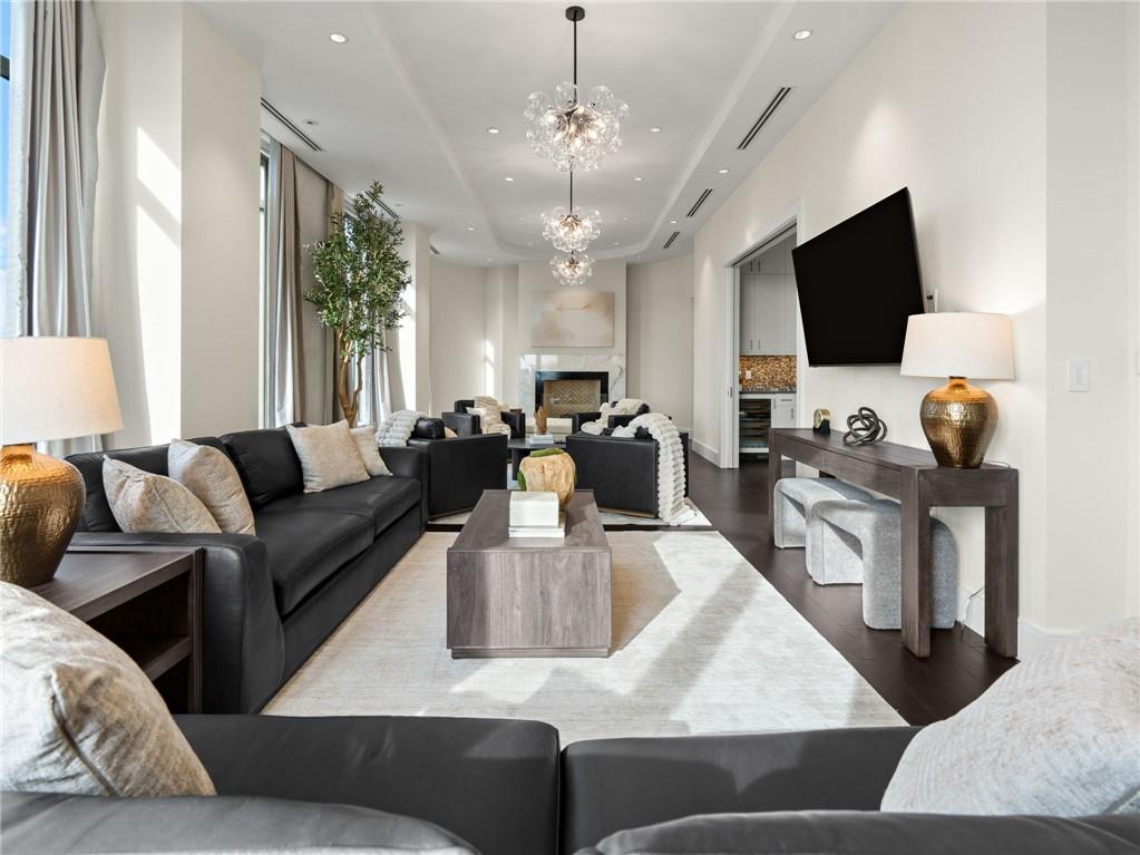 3376 Peachtree Road Northeast, Unit 35B Atlanta, GA 30326 - Photo 14 of 80 a living room with furniture and a flat screen tv