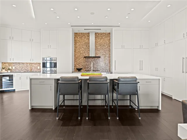 a spacious bedroom with a bed and a window