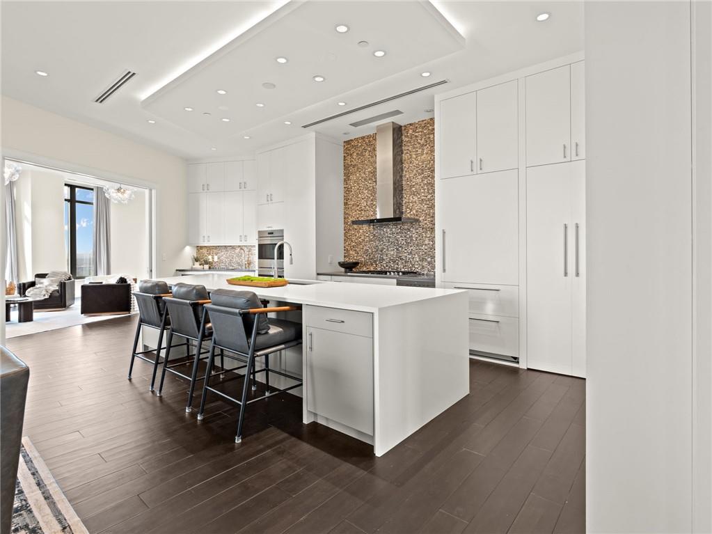 3376 Peachtree Road Northeast, Unit 35B Atlanta, GA 30326 - Photo 21 of 80 a view of kitchen with sink table and chairs