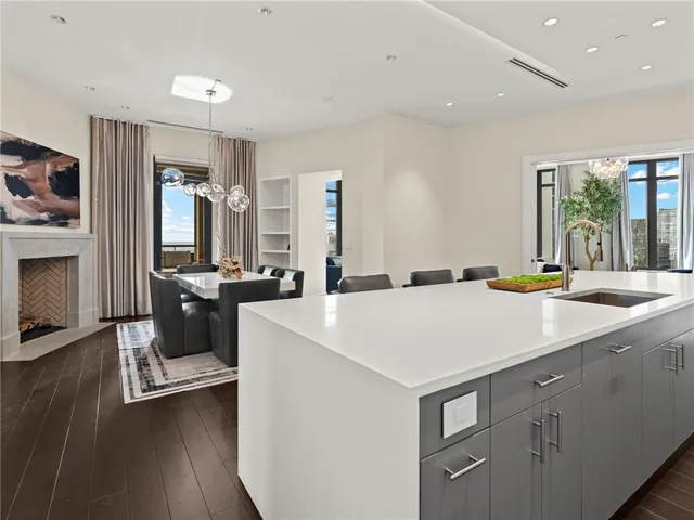 a bed sitting in a spacious bedroom next to a window