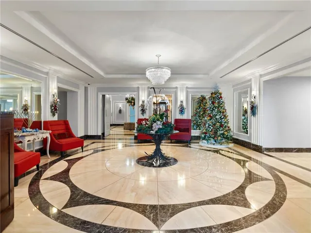 a view of a living room and entry way