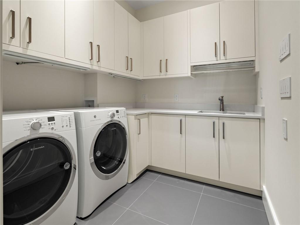 3376 Peachtree Road Northeast, Unit 35B Atlanta, GA 30326 - Photo 31 of 80 a utility room with dryer and washer