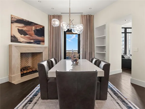 a bathroom with a granite countertop sink and a large mirror next to a window