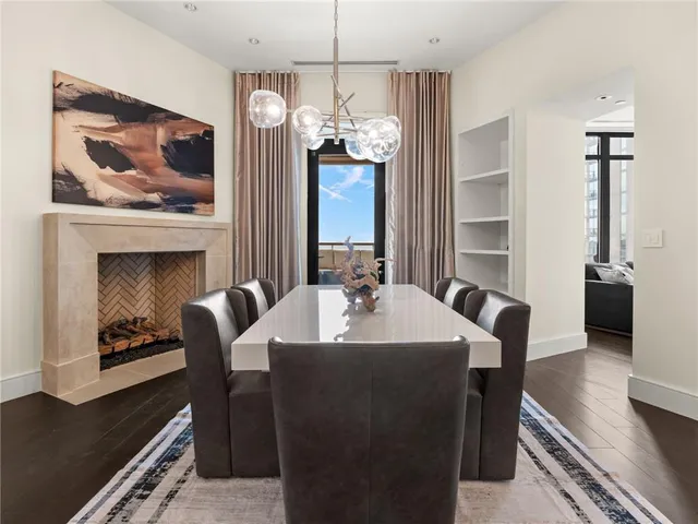 a bathroom with a granite countertop sink and a large mirror next to a window