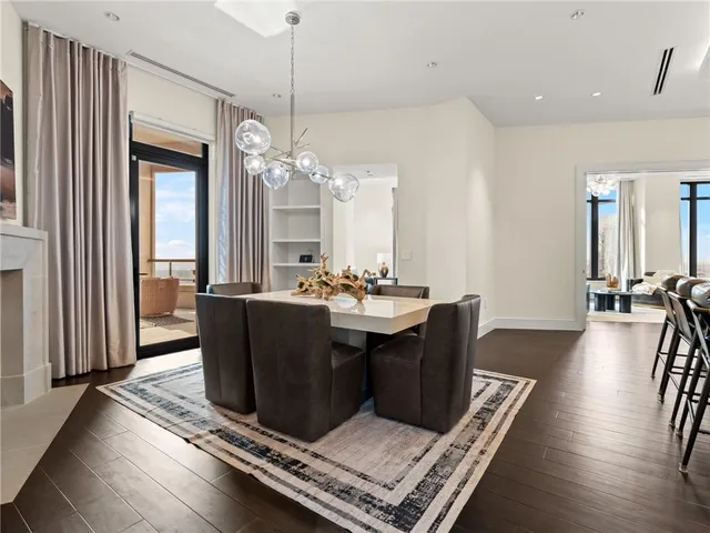 a bathroom with a sink a toilet and a large mirror