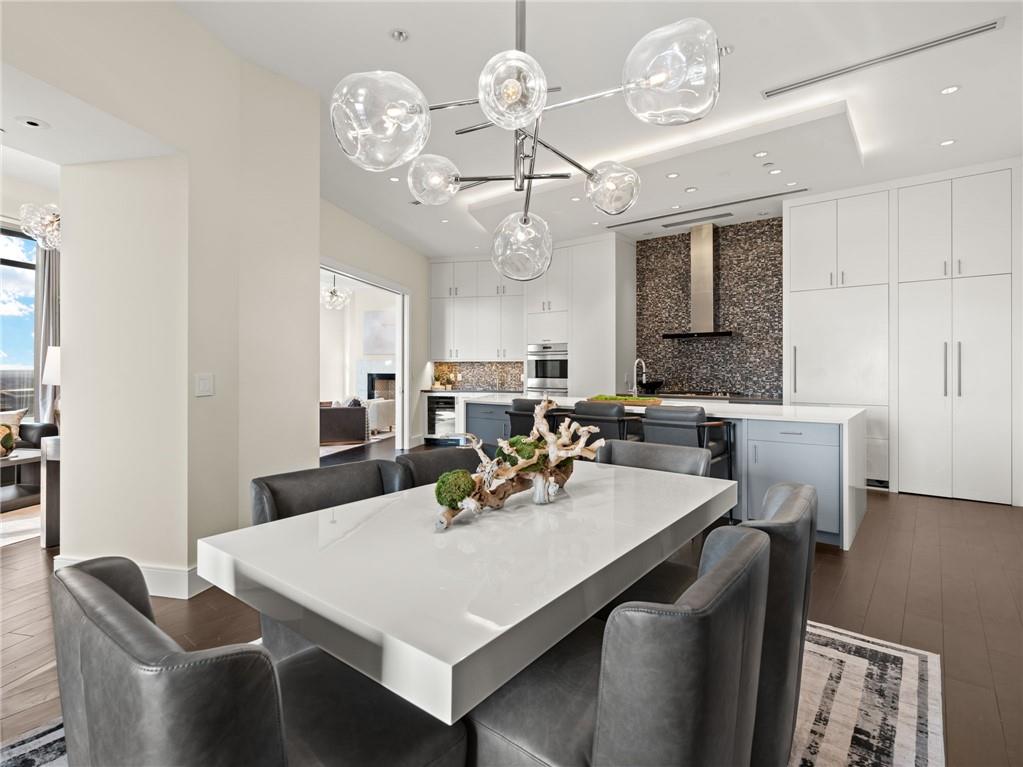 3376 Peachtree Road Northeast, Unit 35B Atlanta, GA 30326 - Photo 36 of 80 a view of a dining room with furniture and a chandelier