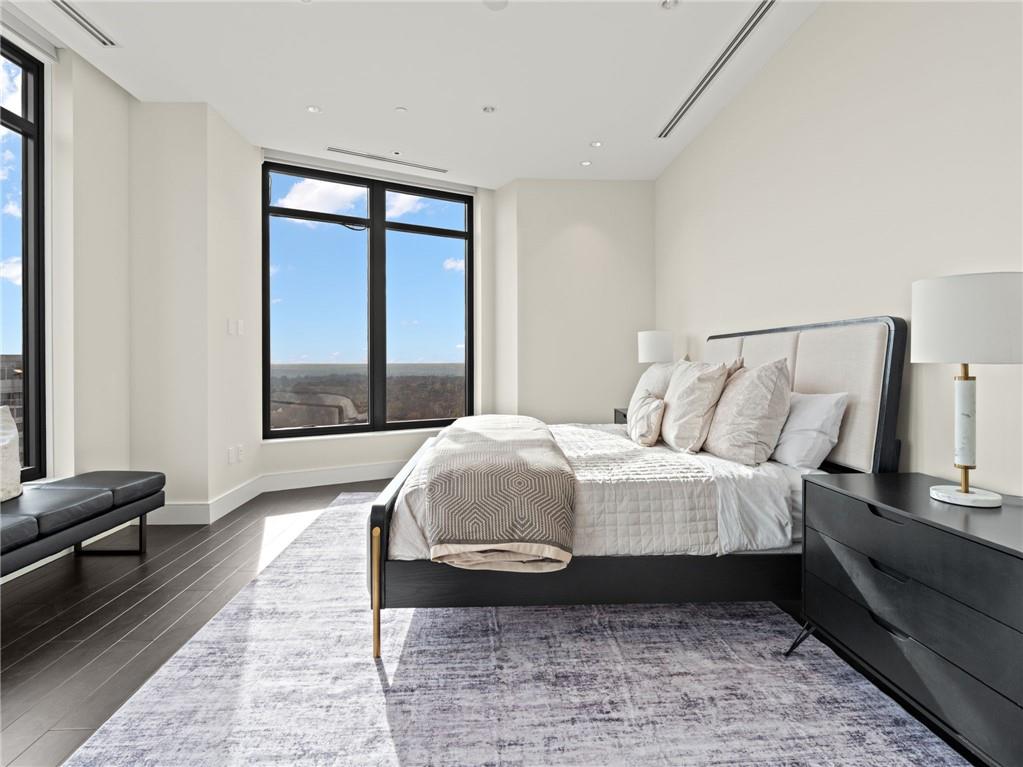 3376 Peachtree Road Northeast, Unit 35B Atlanta, GA 30326 - Photo 39 of 80 a spacious bedroom with a bed and a window