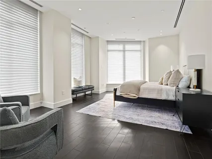 a bedroom with a bed and a lamp