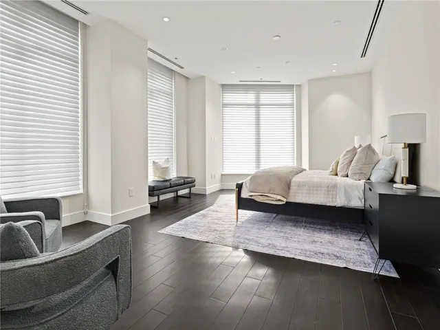 a bedroom with a bed and a lamp