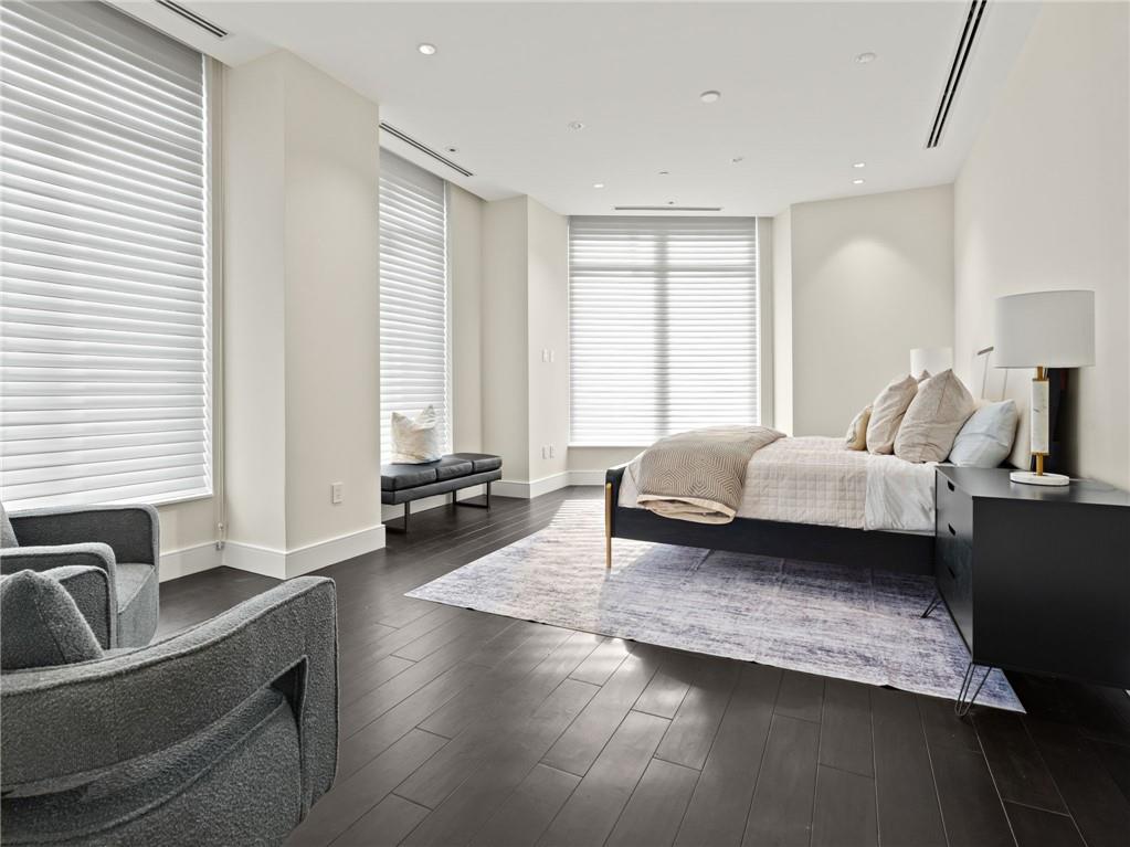 3376 Peachtree Road Northeast, Unit 35B Atlanta, GA 30326 - Photo 43 of 80 a spacious bedroom with a bed a couch and large window