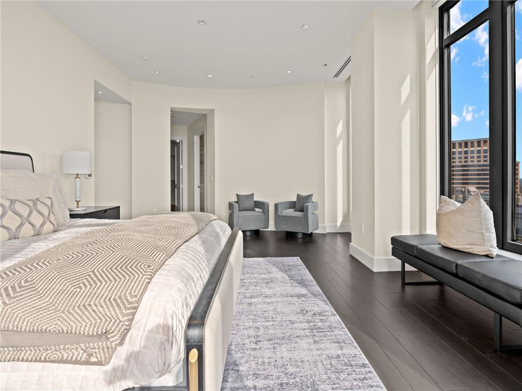 3376 Peachtree Road Northeast, Unit 35B Atlanta, GA 30326 - Photo 45 of 80 a spacious bedroom with a bed and a window