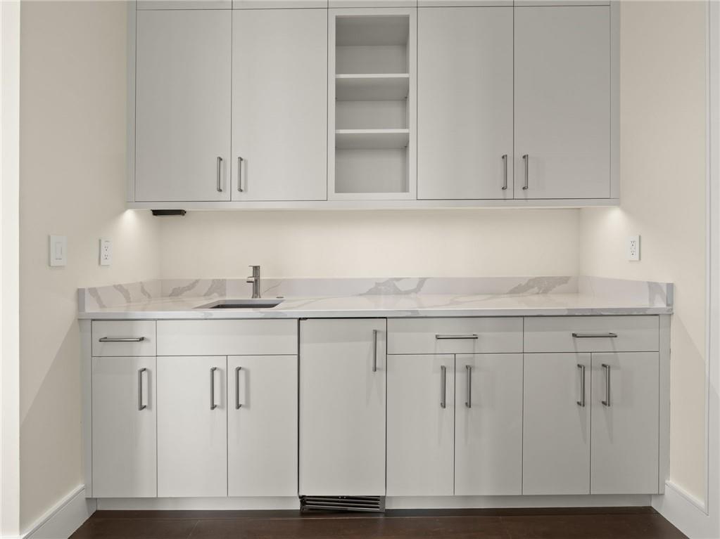 3376 Peachtree Road Northeast, Unit 35B Atlanta, GA 30326 - Photo 47 of 80 a kitchen with granite countertop white cabinets and a sink