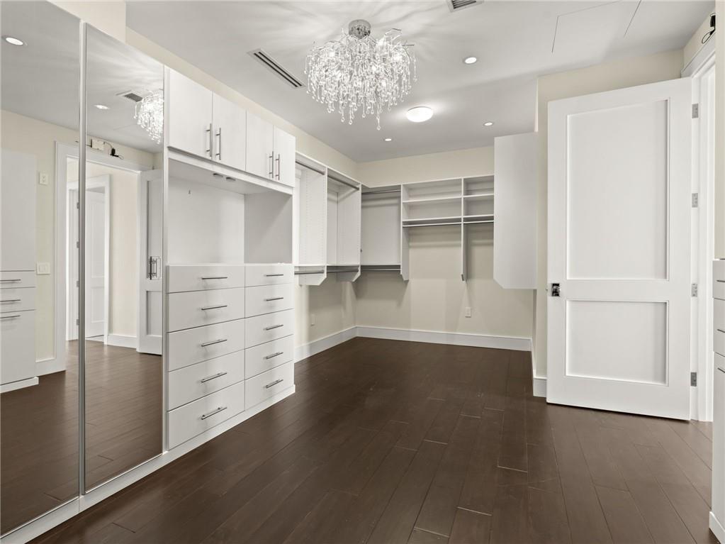 3376 Peachtree Road Northeast, Unit 35B Atlanta, GA 30326 - Photo 49 of 80 an empty room with wooden floor cabinet and windows