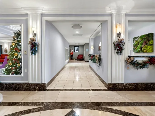 a view of a bedroom with a bed and a window