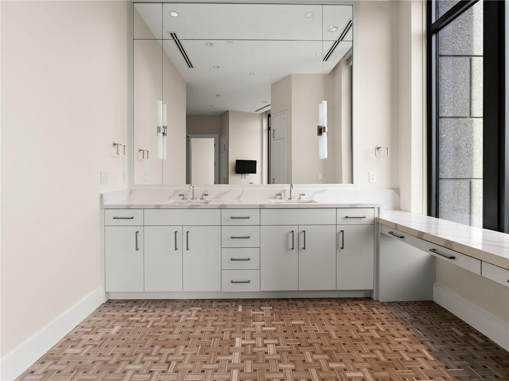 3376 Peachtree Road Northeast, Unit 35B Atlanta, GA 30326 - Photo 54 of 80 a bathroom with a sink a vanity and a mirror