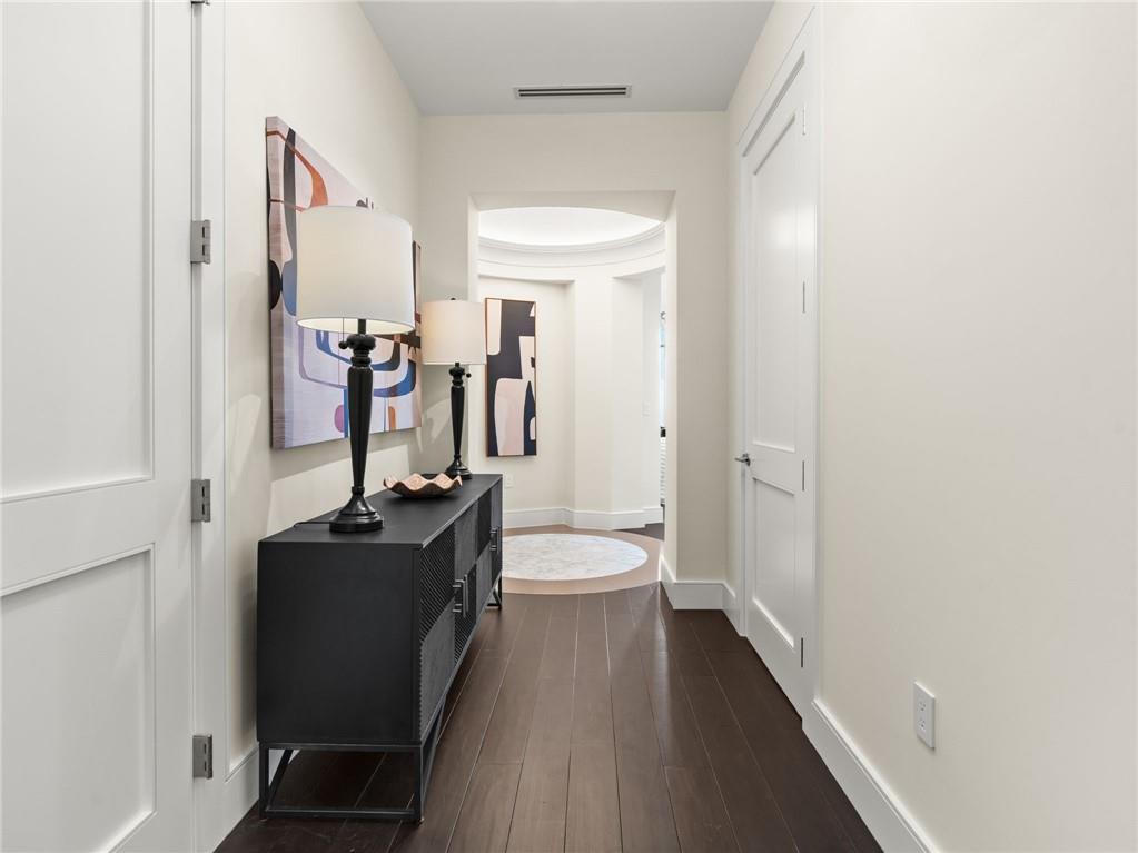 3376 Peachtree Road Northeast, Unit 35B Atlanta, GA 30326 - Photo 59 of 80 a bathroom with a sink a toilet and a large mirror