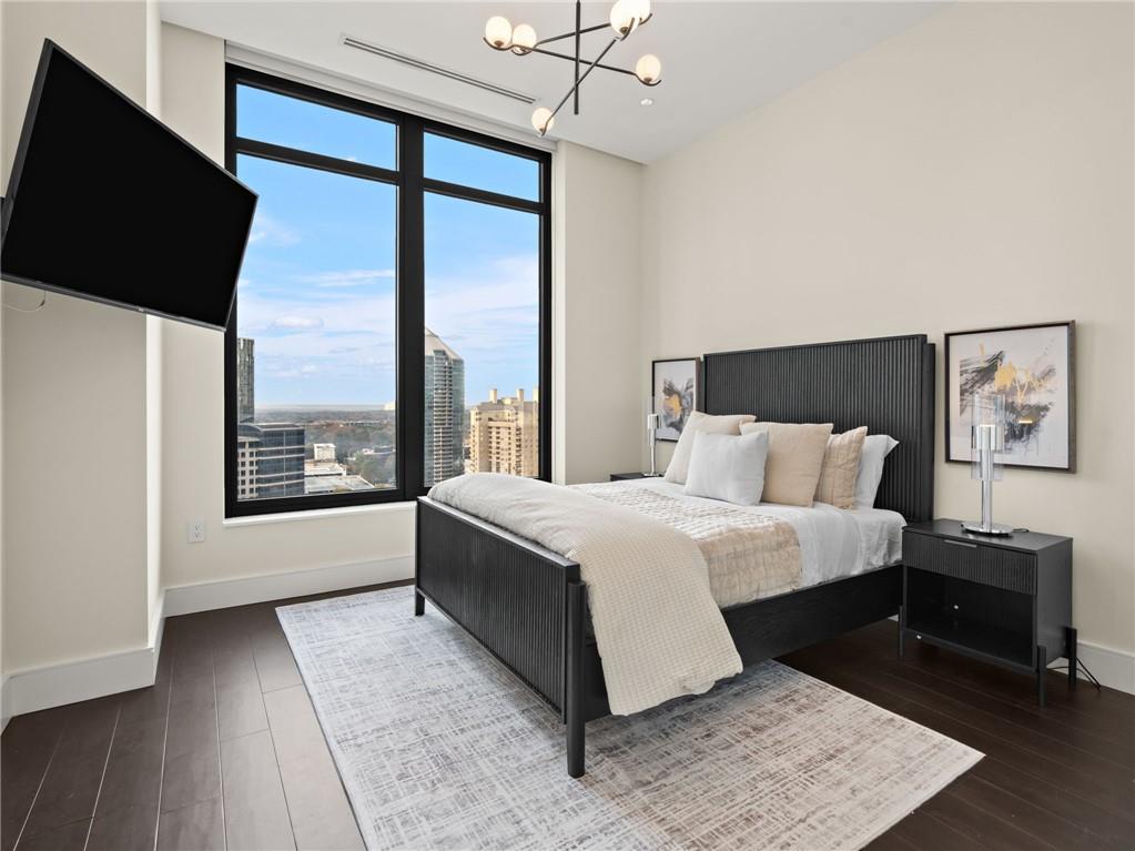 3376 Peachtree Road Northeast, Unit 35B Atlanta, GA 30326 - Photo 62 of 80 a bed room with a bed and a large window