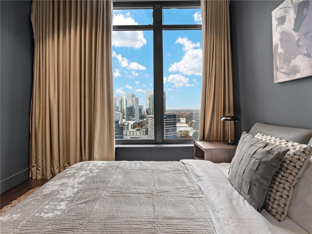 3376 Peachtree Road Northeast, Unit 35B Atlanta, GA 30326 - Photo 67 of 80 a bedroom with a large bed and a large window