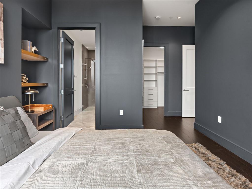 3376 Peachtree Road Northeast, Unit 35B Atlanta, GA 30326 - Photo 68 of 80 a bedroom with a bed and a lamp