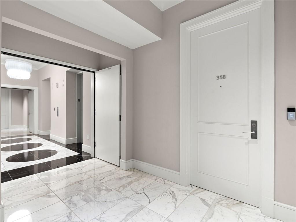 3376 Peachtree Road Northeast, Unit 35B Atlanta, GA 30326 - Photo 8 of 80 a view of a bedroom with a bed and a window