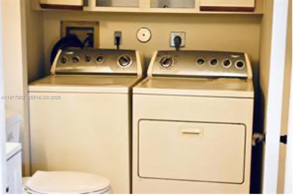 a utility room with dryer and washer